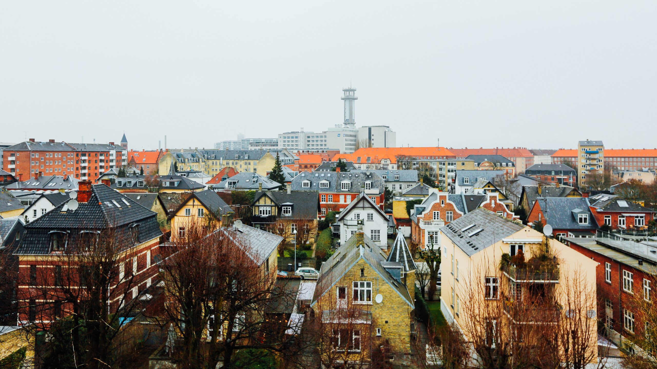 A wide shot of houses and buildings in the city of Copenhagen, Denmark